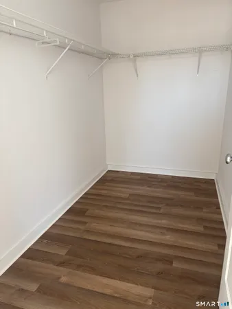 a view of an empty walk in closet