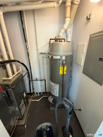 a view of gym equipment with wooden floor