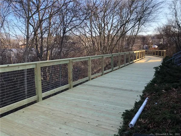 a view of a balcony with trees