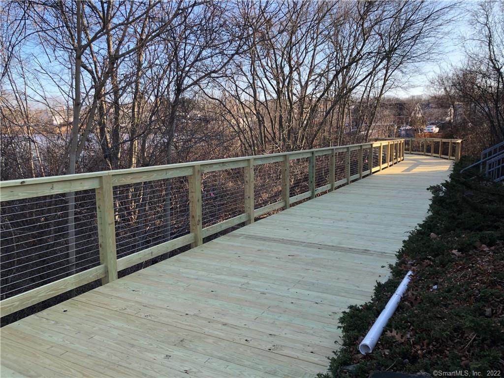 22 Durham Road, Unit A2 Madison, CT 06443 - Photo 17 of 22 a balcony with trees in front of it