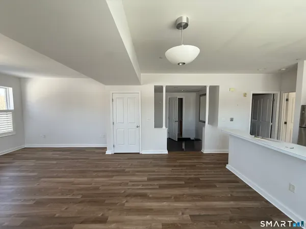 a view of a livingroom with wooden floor
