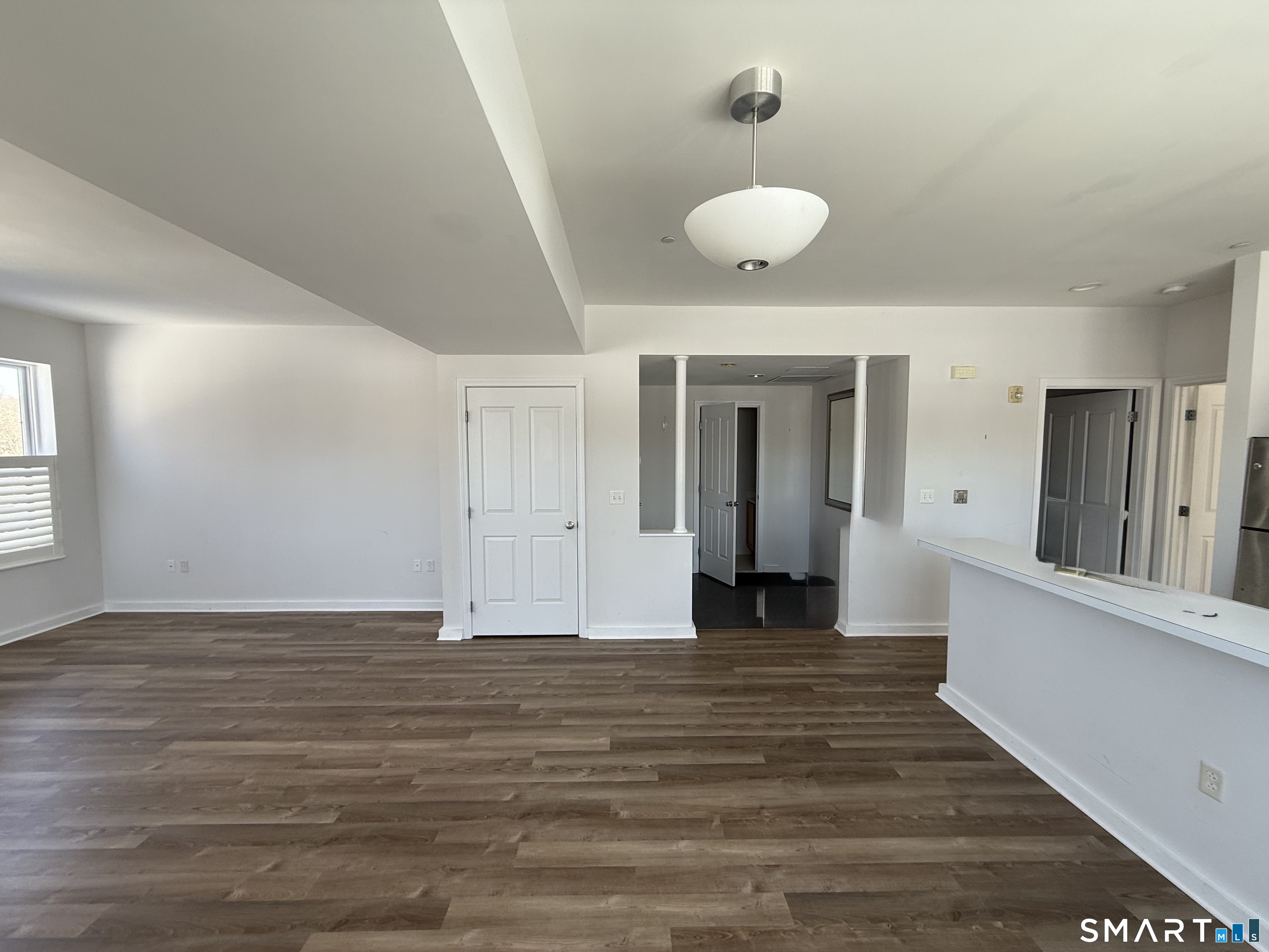 22 Durham Road, Unit A2 Madison, CT 06443 - Photo 4 of 22 a view of a livingroom with wooden floor