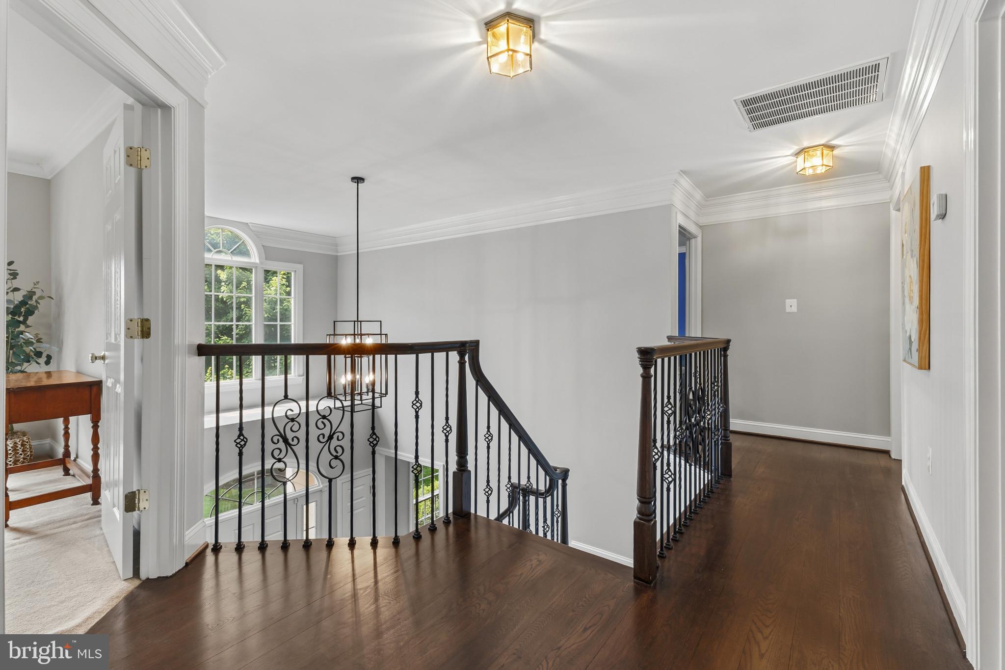 15006 Ransom Oaks Court Gainesville, VA 20155 - Photo 17 of 57 Elegant staircase in bright hallway.