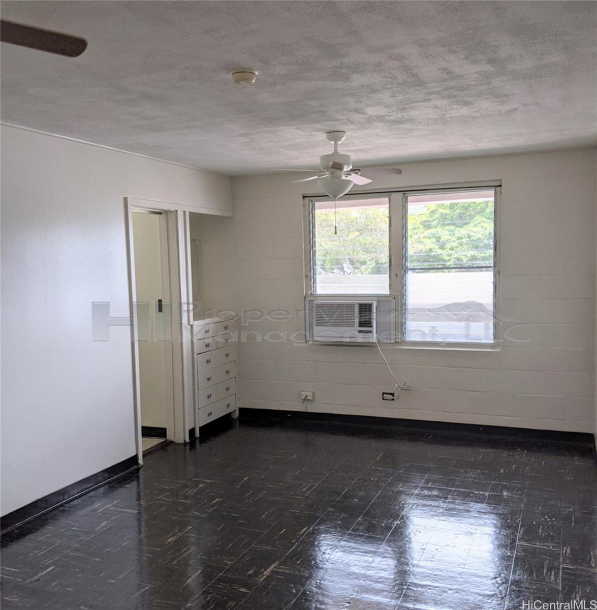 656 Kailua Road, Unit 3 Kailua, HI 96734 - Photo 1 of 1 an empty room with wooden floor and windows