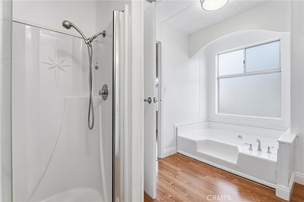 4901 Green River Road, Unit 140 Corona, CA 92878 - Photo 12 of 21 a bathroom with a tub and a sink