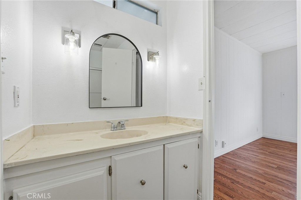 4901 Green River Road, Unit 140 Corona, CA 92878 - Photo 14 of 21 a bathroom with a sink and a mirror