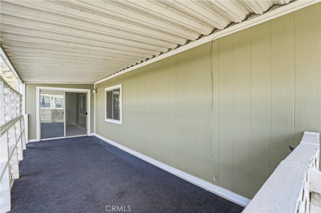 4901 Green River Road, Unit 140 Corona, CA 92878 - Photo 21 of 21 a view of hallway with windows