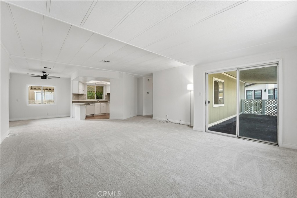 4901 Green River Road, Unit 140 Corona, CA 92878 - Photo 4 of 21 an empty room with windows and cabinet