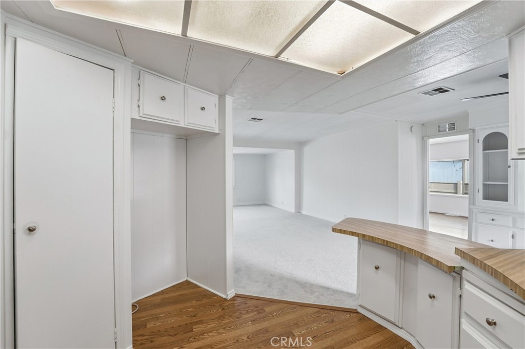 4901 Green River Road, Unit 140 Corona, CA 92878 - Photo 8 of 21 a kitchen with granite countertop a sink and cabinets