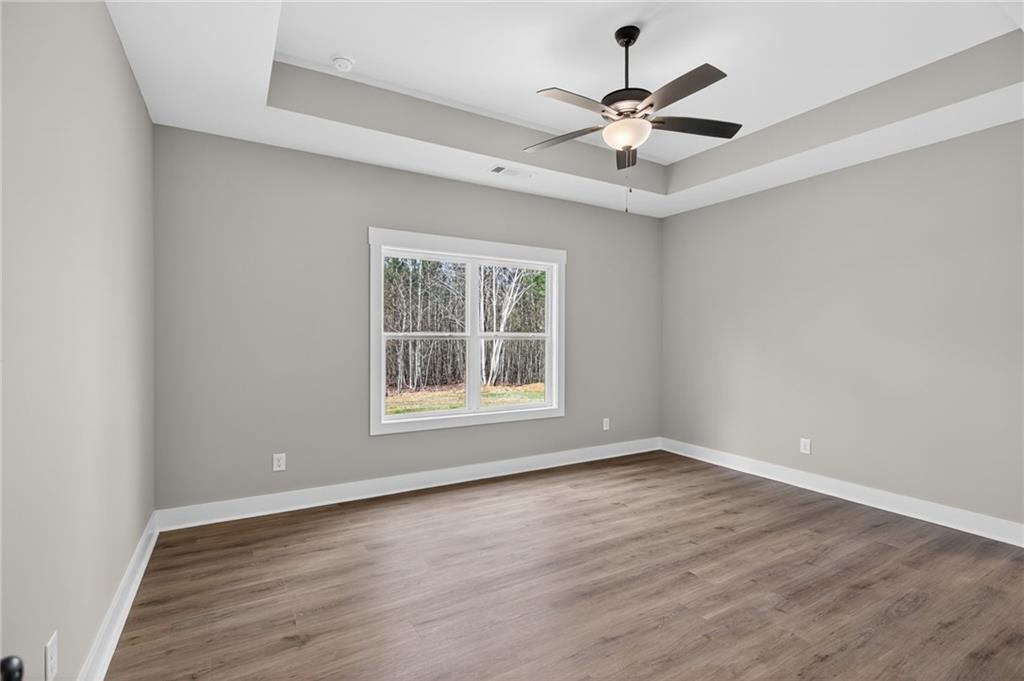 423 Relay Road Silver Creek, GA 30173 - Photo 25 of 48 wooden floor in an empty room with a window
