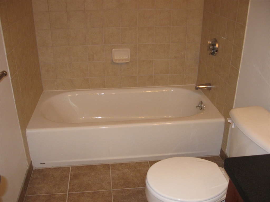 2856 Washington Street Boston, MA 02119 - Photo 23 of 39 a white toilet sitting next to a bath tub
