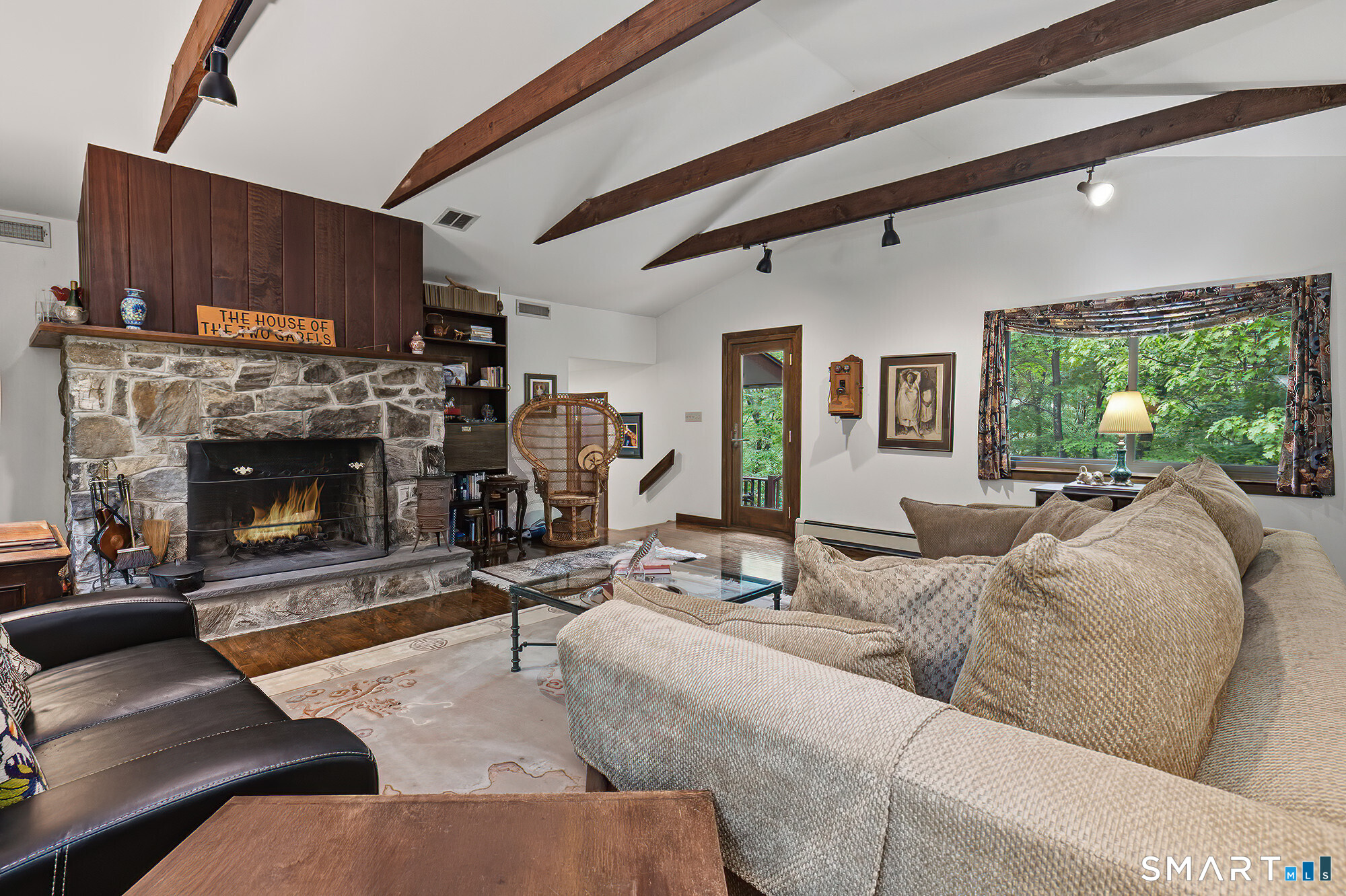 342 Barrack Hill Road Ridgefield, CT 06877 - Photo 2 of 40 Beautiful large living room with stone fireplace and door out to deck