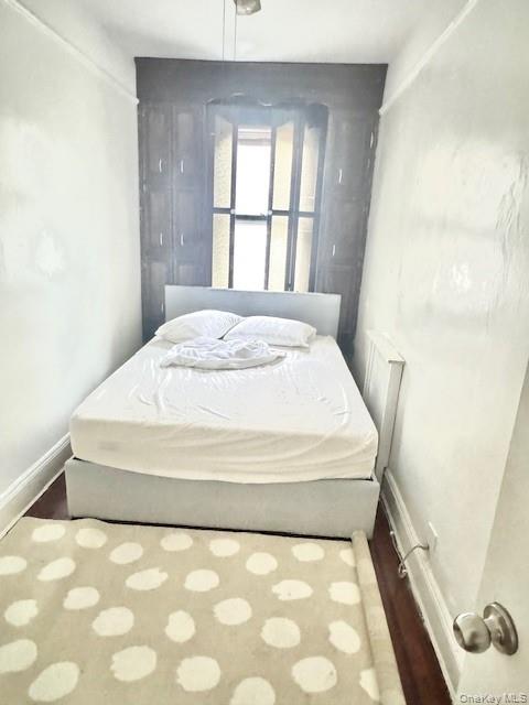 45-47 43rd Street Queens, NY 11104 - Photo 13 of 26 Bedroom with wood finished floors and baseboards