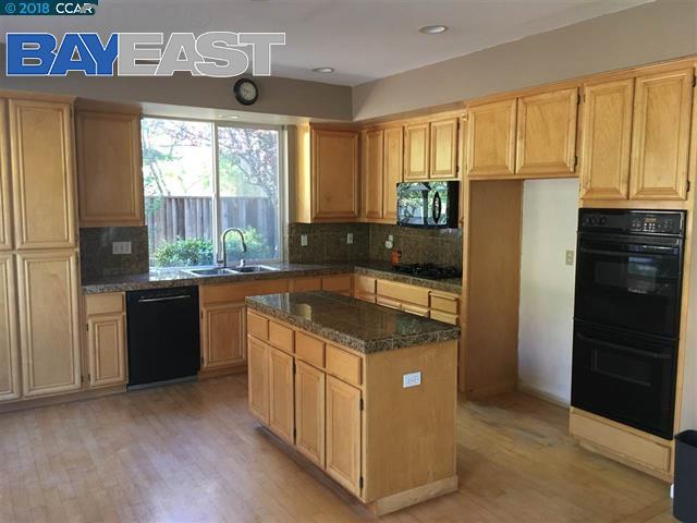 221 Azalea Lane San Ramon, CA 94582 - Photo 2 of 4 a kitchen with a stove a refrigerator and a sink
