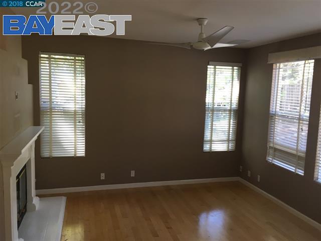 221 Azalea Lane San Ramon, CA 94582 - Photo 4 of 4 an empty room with wooden floor and windows