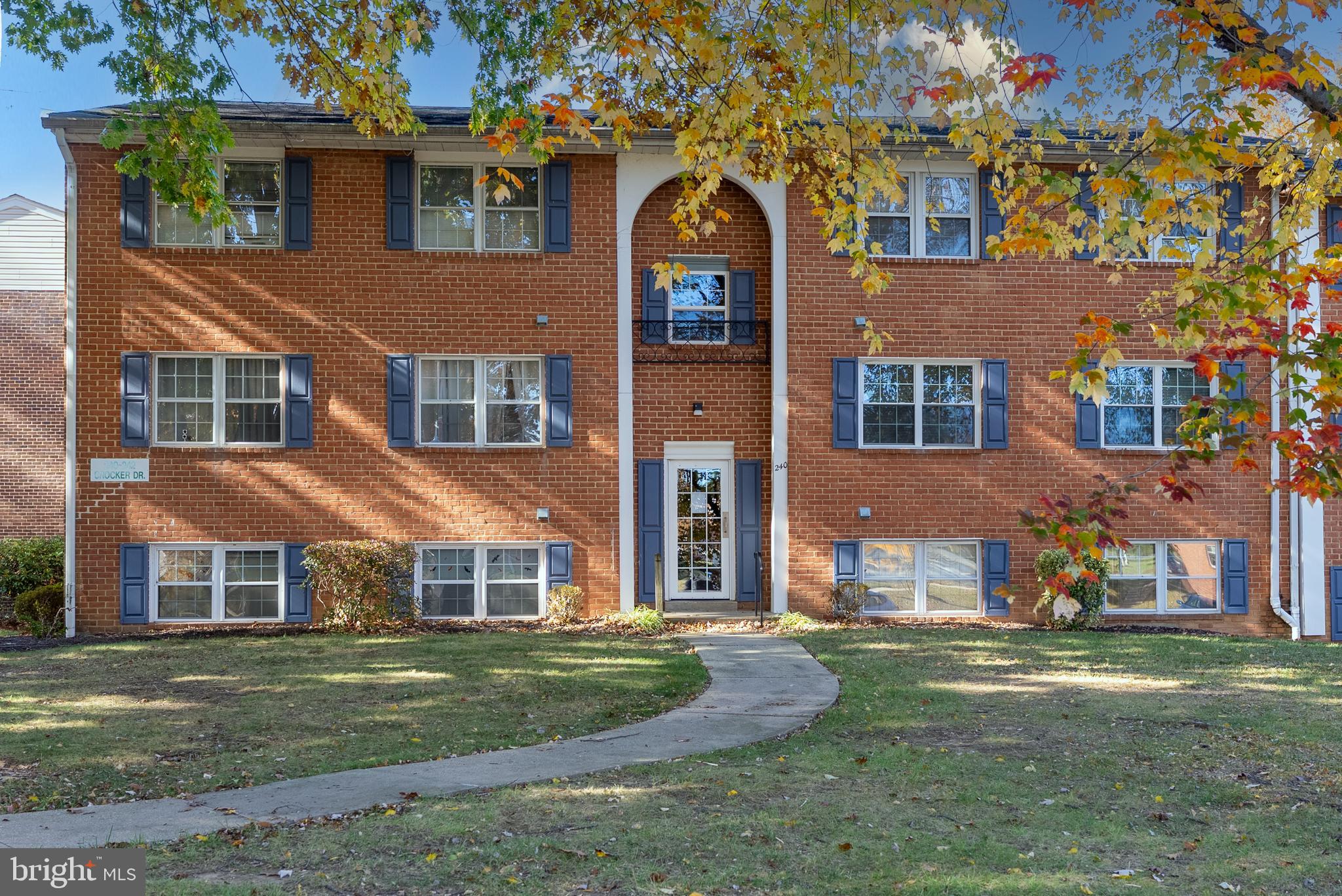 240 Crocker Drive, Unit 240F Bel Air, MD 21014 - Photo 1 of 38 a view of a big yard in front of a brick house with a large windows