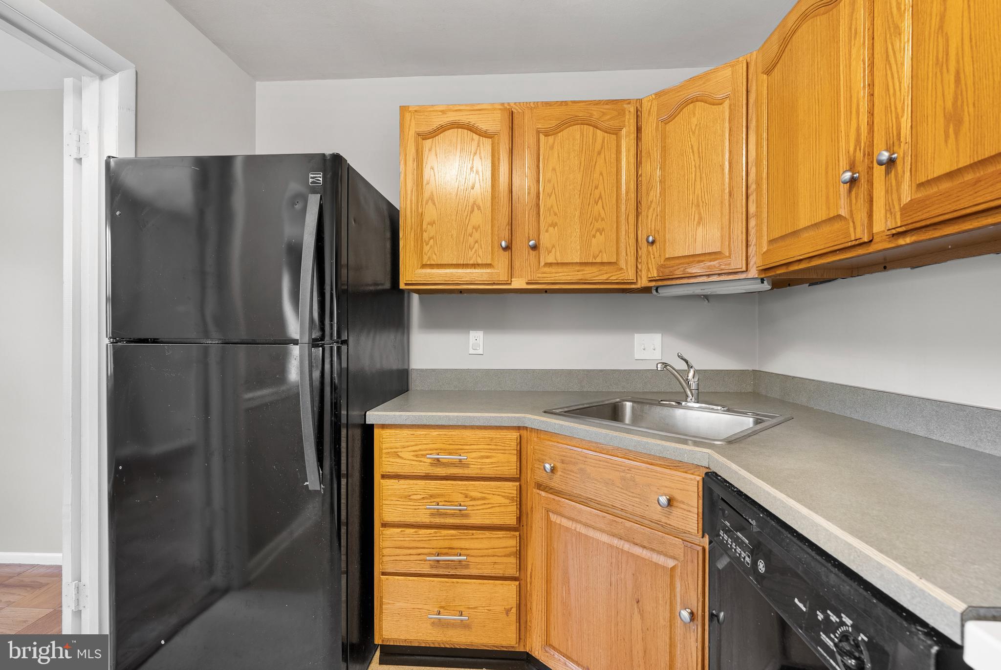 240 Crocker Drive, Unit 240F Bel Air, MD 21014 - Photo 15 of 38 a kitchen with stainless steel appliances granite countertop a refrigerator and a sink