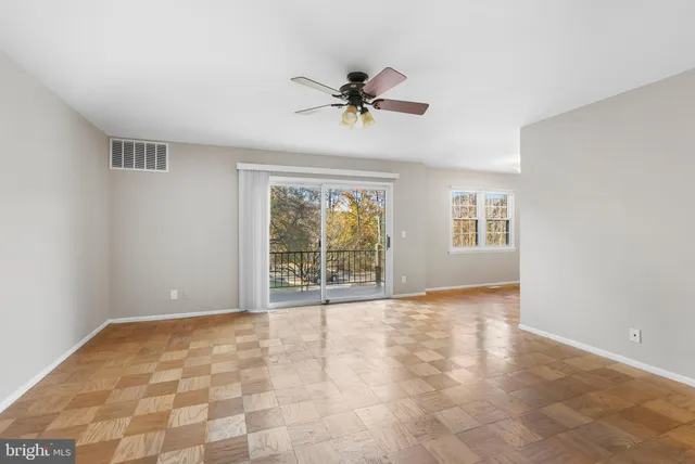 a view of an empty room with a window