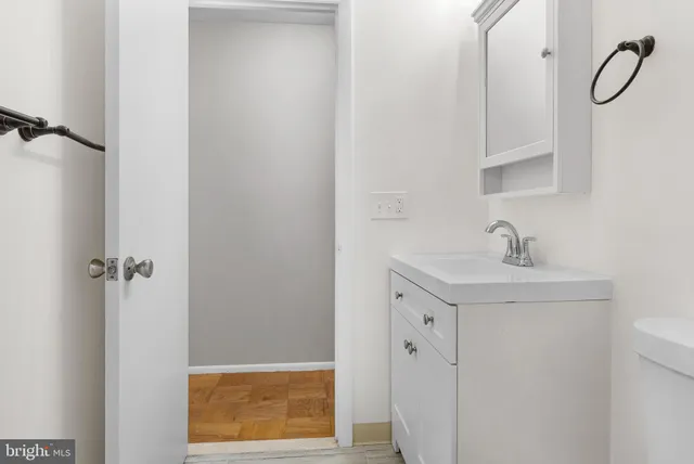 a bathroom with a shower sink and mirror