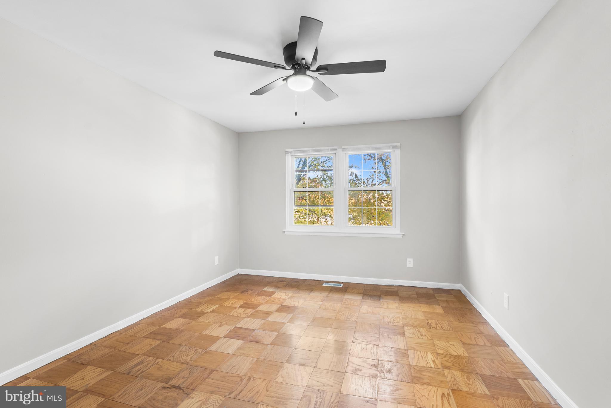 240 Crocker Drive, Unit 240F Bel Air, MD 21014 - Photo 31 of 38 an empty room with windows and ceiling fan