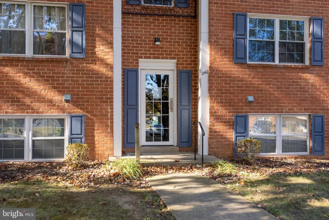 a front view of building with yard