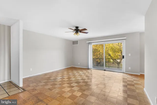 a view of an empty room with a window