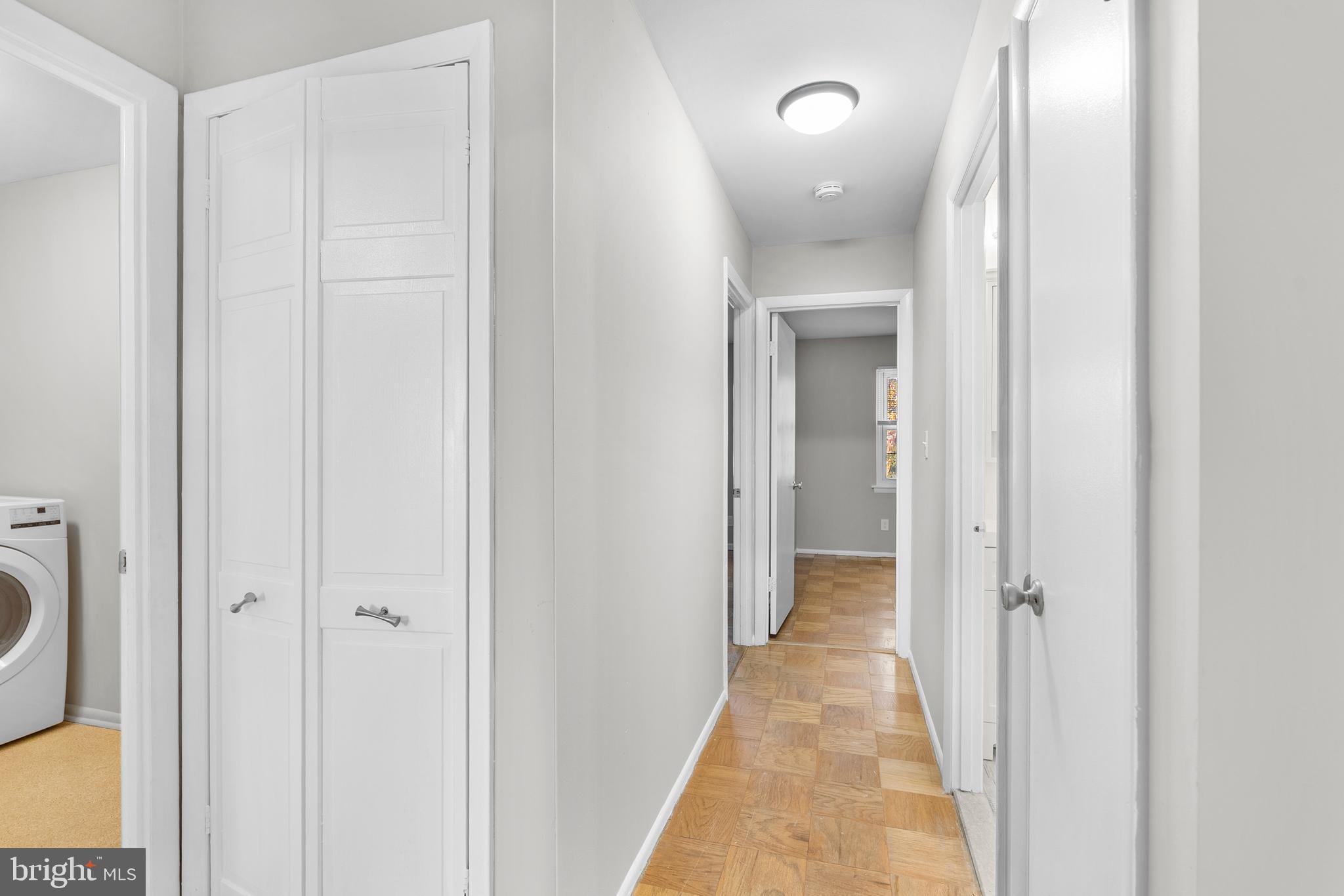 240 Crocker Drive, Unit 240F Bel Air, MD 21014 - Photo 9 of 38 a view of a hallway with wooden floor and a bathroom