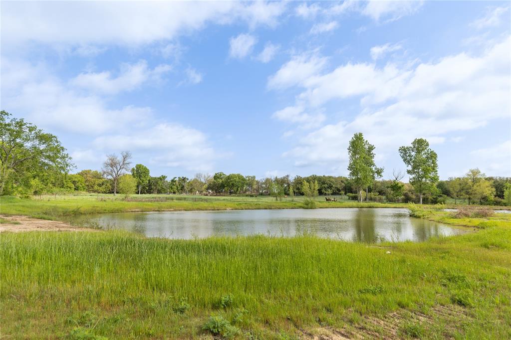 8016 Highway 82 Gainesville, TX 76240 - Photo 19 of 24 a view of a lake with houses in the back