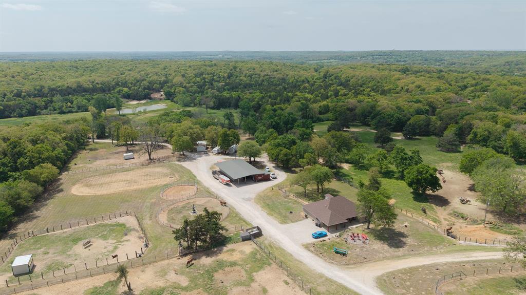 8016 Highway 82 Gainesville, TX 76240 - Photo 5 of 24 an aerial view of a house with a yard