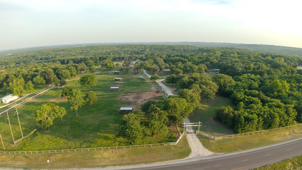 8016 Highway 82 Gainesville, TX 76240 - Photo 7 of 24 an aerial view of residential houses with outdoor space