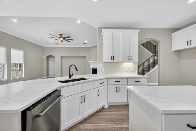 a kitchen with a sink cabinets and window