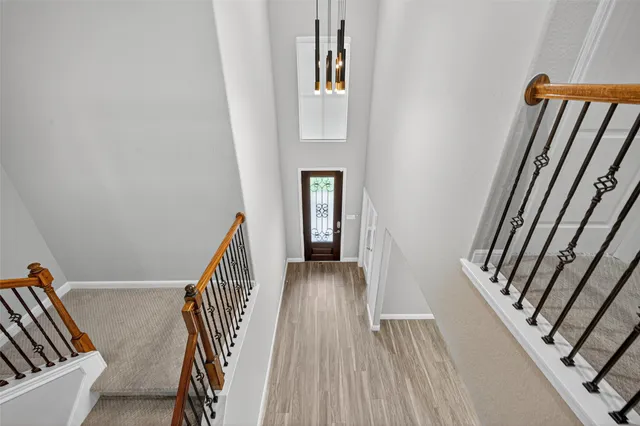 a view of an empty room with stairs