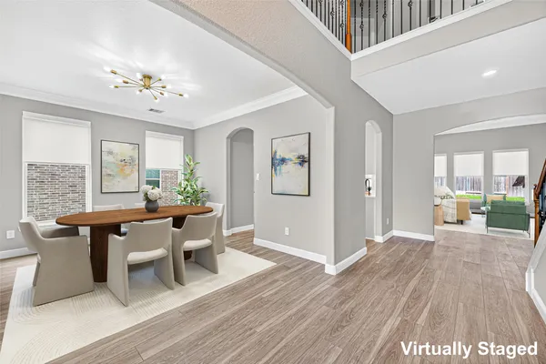 a view of a livingroom with furniture window and wooden floor