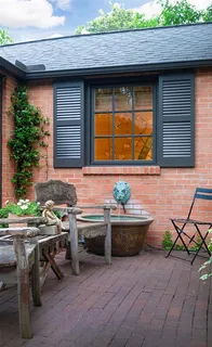 a backyard of a house with seating space