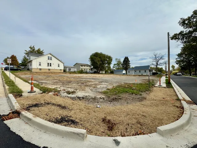 a view of a living room and kitchen