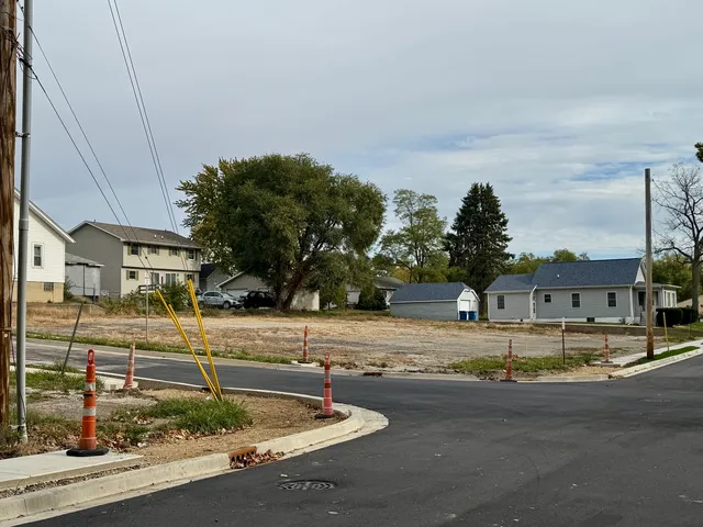a view of a patio with a table and chairs