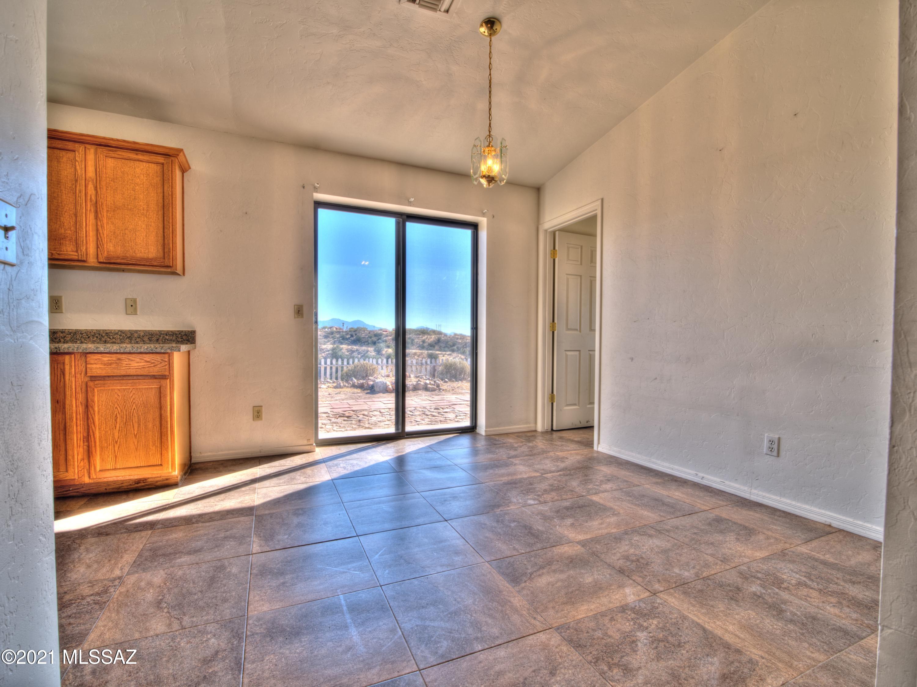 381 Tala Court Rio Rico, AZ 85648 - Photo 8 of 19 a view of an empty room with a window