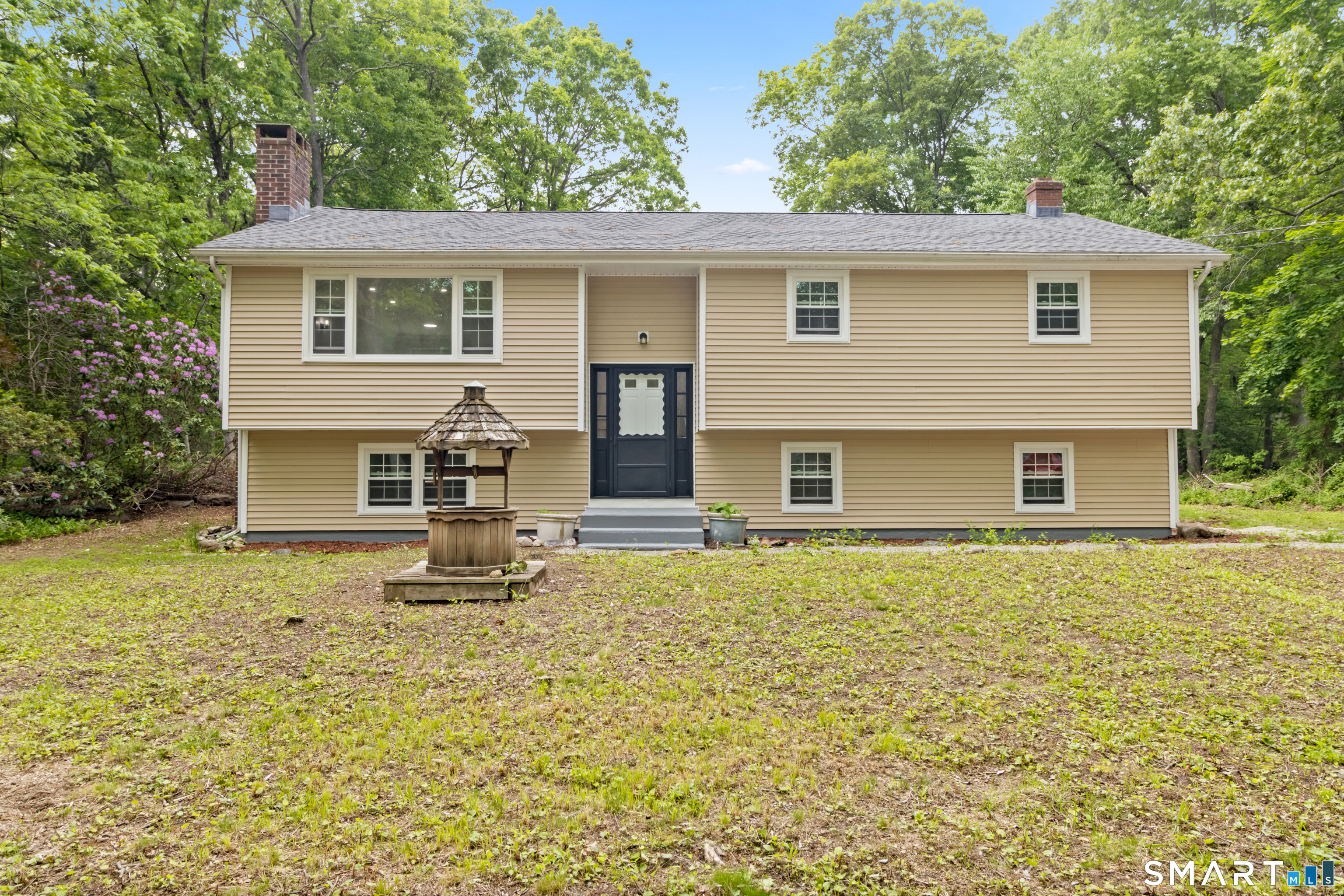 20 Quiet Woods Road East Hampton, CT 06424 - Photo 35 of 40 a front view of a house with a yard