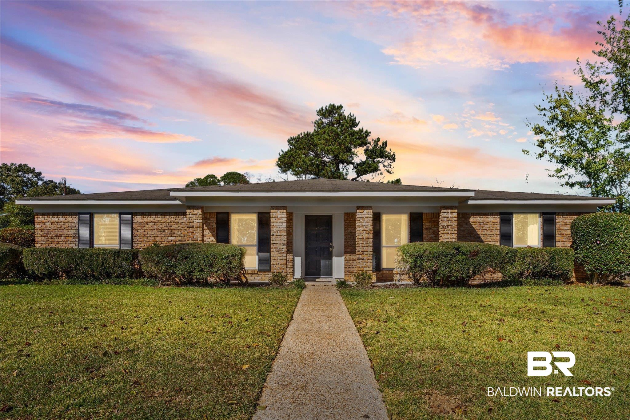 6300 Christopher Drive North Mobile, AL 36609 - Photo 1 of 22 Ranch-style home with a front yard, brick siding, and covered porch
