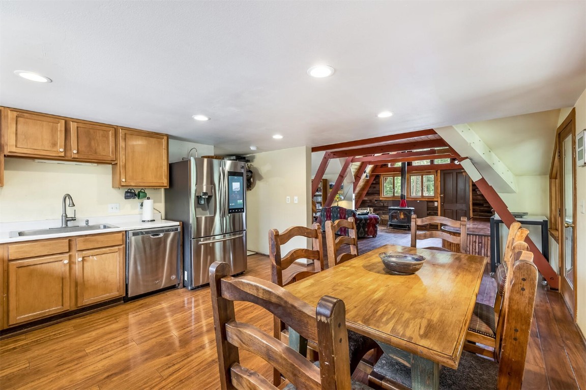 5115 Montezuma Road Montezuma, CO 80435 - Photo 14 of 35 a open kitchen with stainless steel appliances granite countertop a stove and a refrigerator