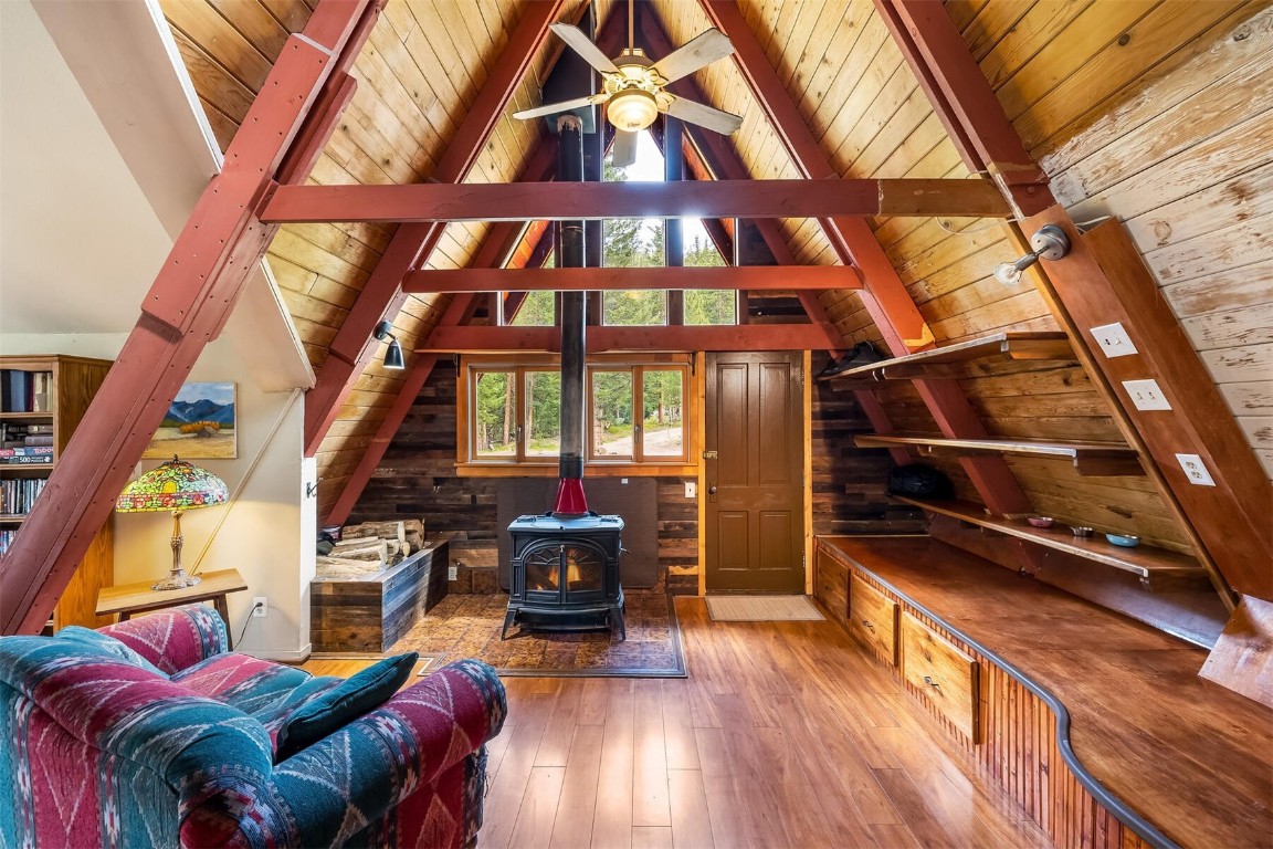 5115 Montezuma Road Montezuma, CO 80435 - Photo 17 of 35 a living room with furniture and a floor to ceiling window