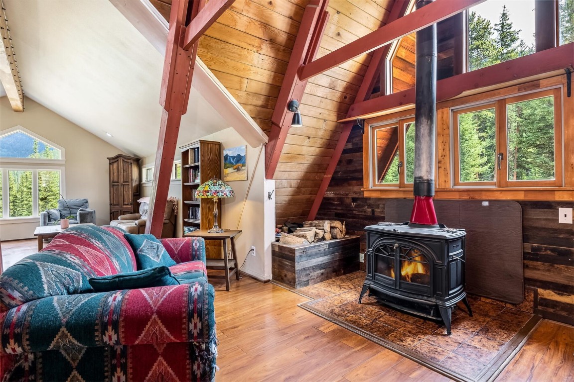 5115 Montezuma Road Montezuma, CO 80435 - Photo 18 of 35 a living room with furniture fireplace and a large window