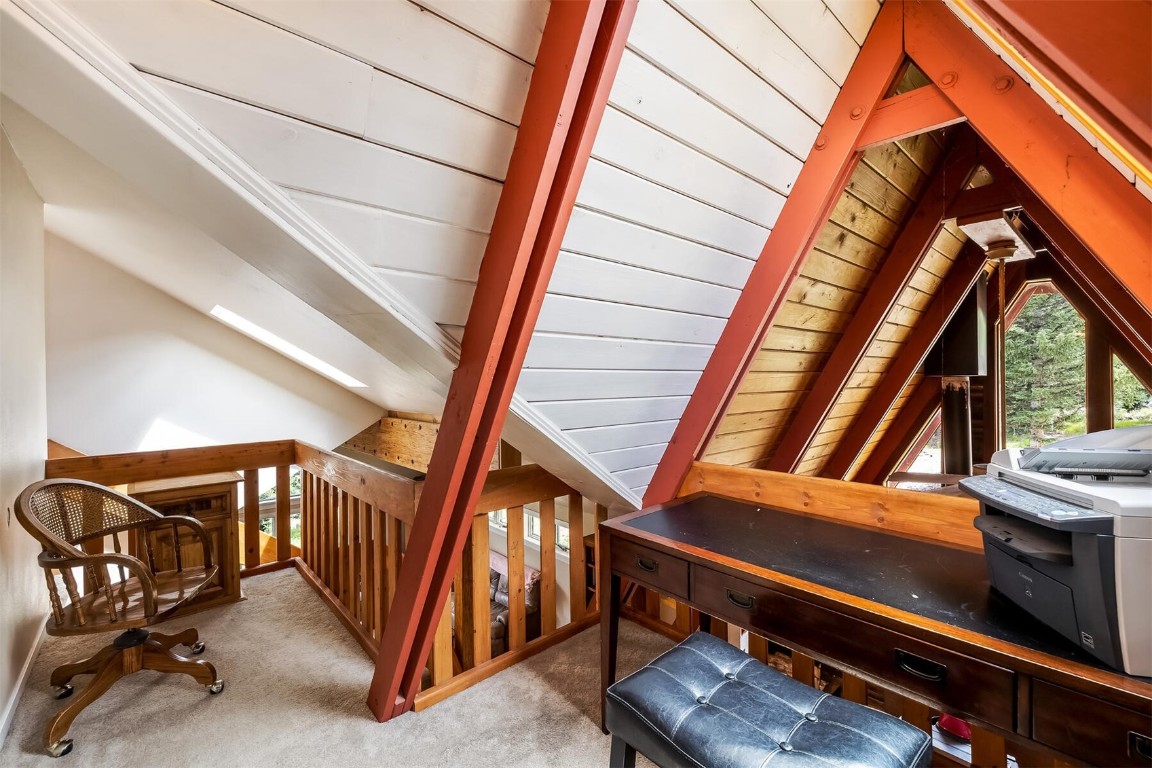 5115 Montezuma Road Montezuma, CO 80435 - Photo 23 of 35 a view of an empty room with stairs and furniture