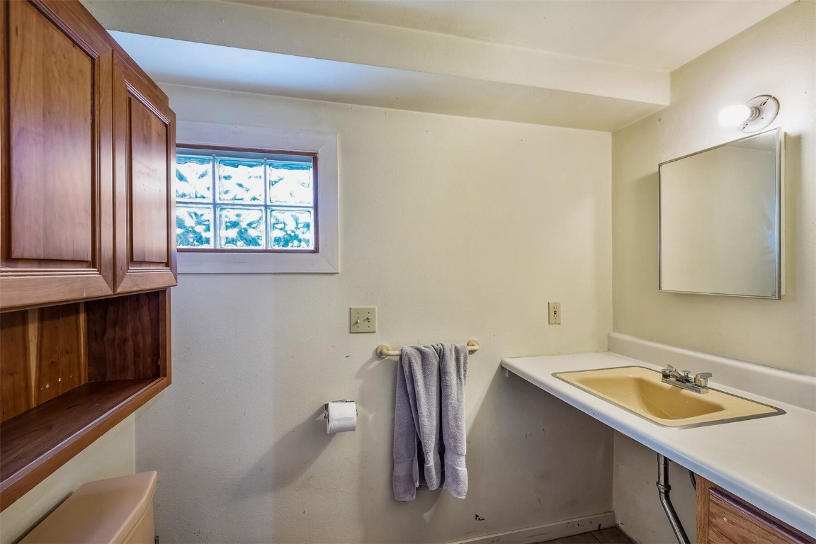 5115 Montezuma Road Montezuma, CO 80435 - Photo 34 of 35 a bathroom with a sink and a mirror