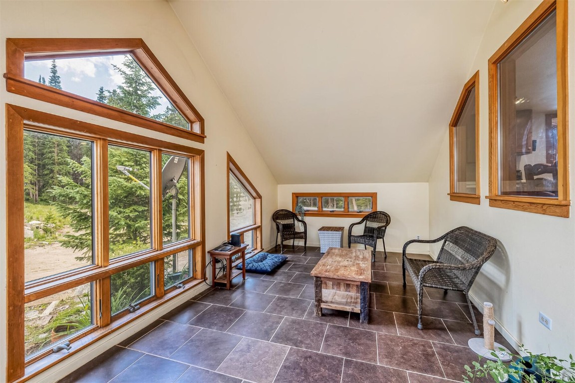 5115 Montezuma Road Montezuma, CO 80435 - Photo 10 of 35 a living room with furniture and a large window