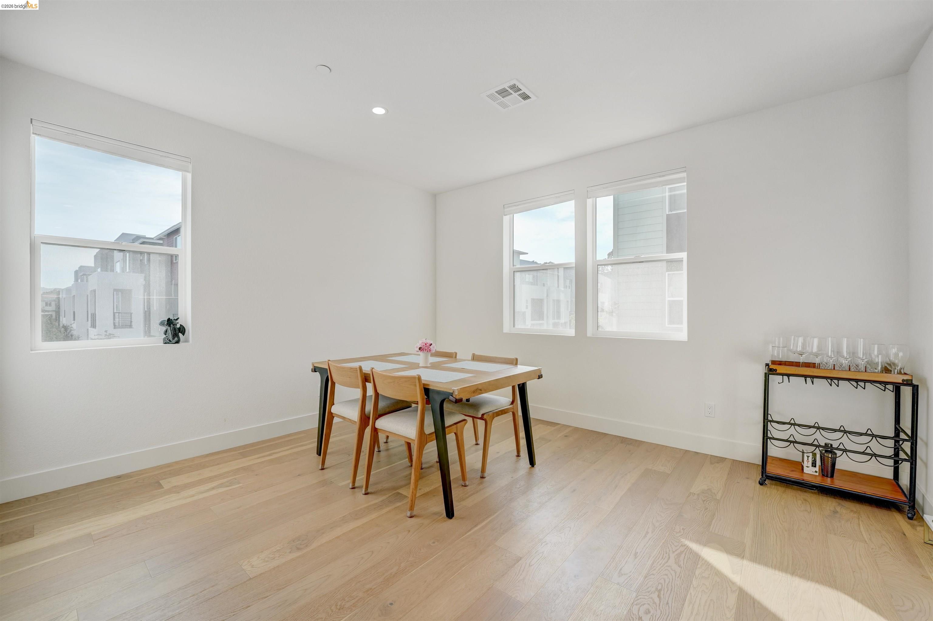 7101 Melon Court San Ramon, CA 94583 - Photo 24 of 58 a dining room with a window and a wooden floor