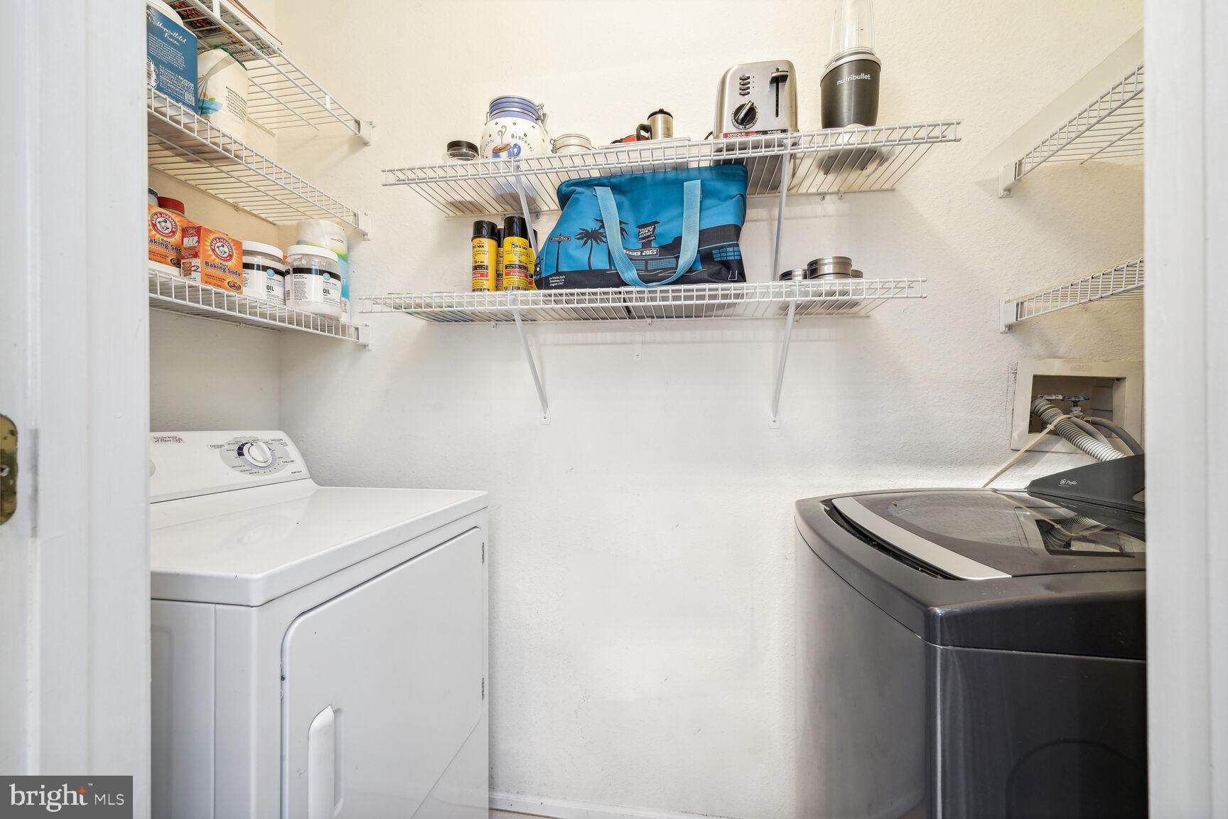 1581 Spring Gate Dr., Unit 5403 McLean, VA 22102 - Photo 12 of 20 a utility room with dryer and washer