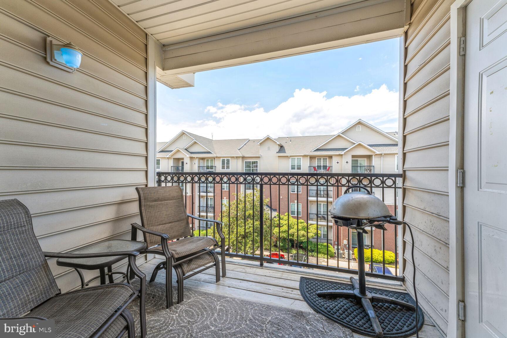 1581 Spring Gate Dr., Unit 5403 McLean, VA 22102 - Photo 13 of 20 a view of a balcony with chairs