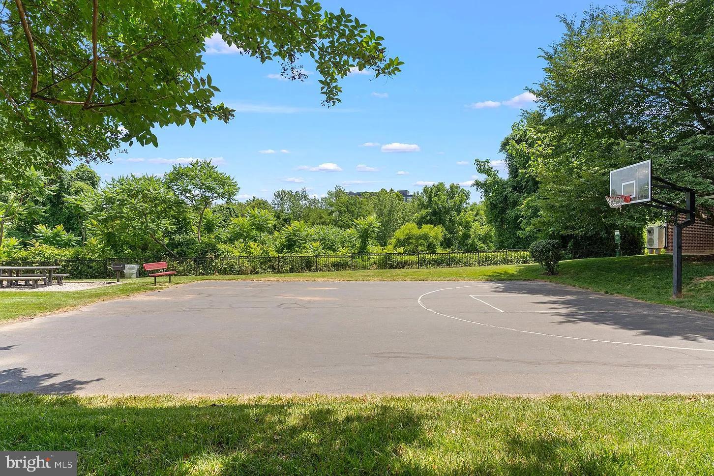 1581 Spring Gate Dr., Unit 5403 McLean, VA 22102 - Photo 18 of 20 a front view of a house with a yard and trees