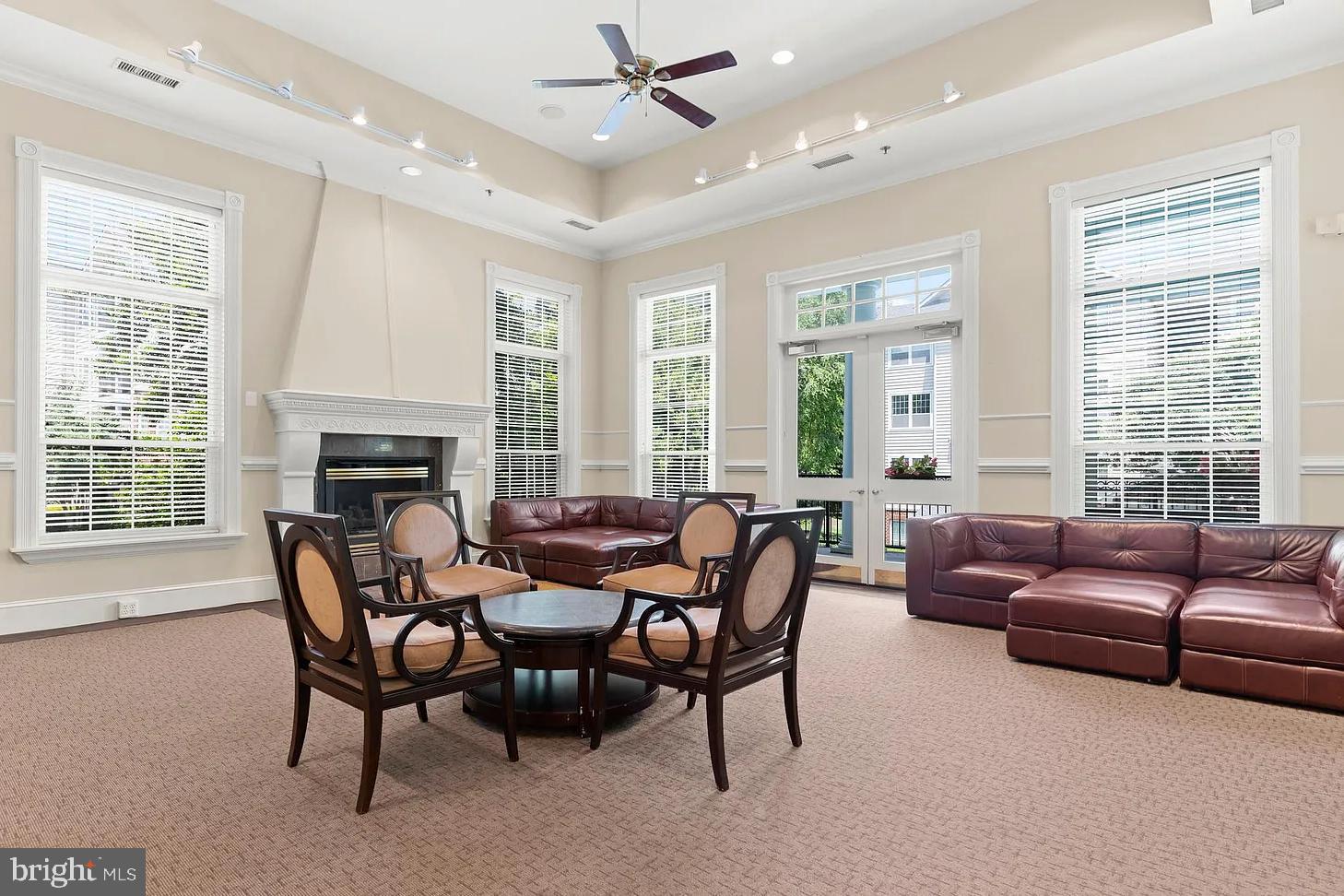 1581 Spring Gate Dr., Unit 5403 McLean, VA 22102 - Photo 19 of 20 a living room with furniture and a large window